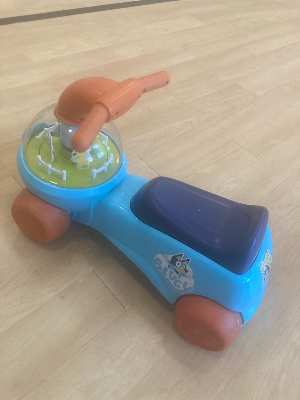 Blue Ride-On Toddler Scooter with Orange Handles and Wheels
